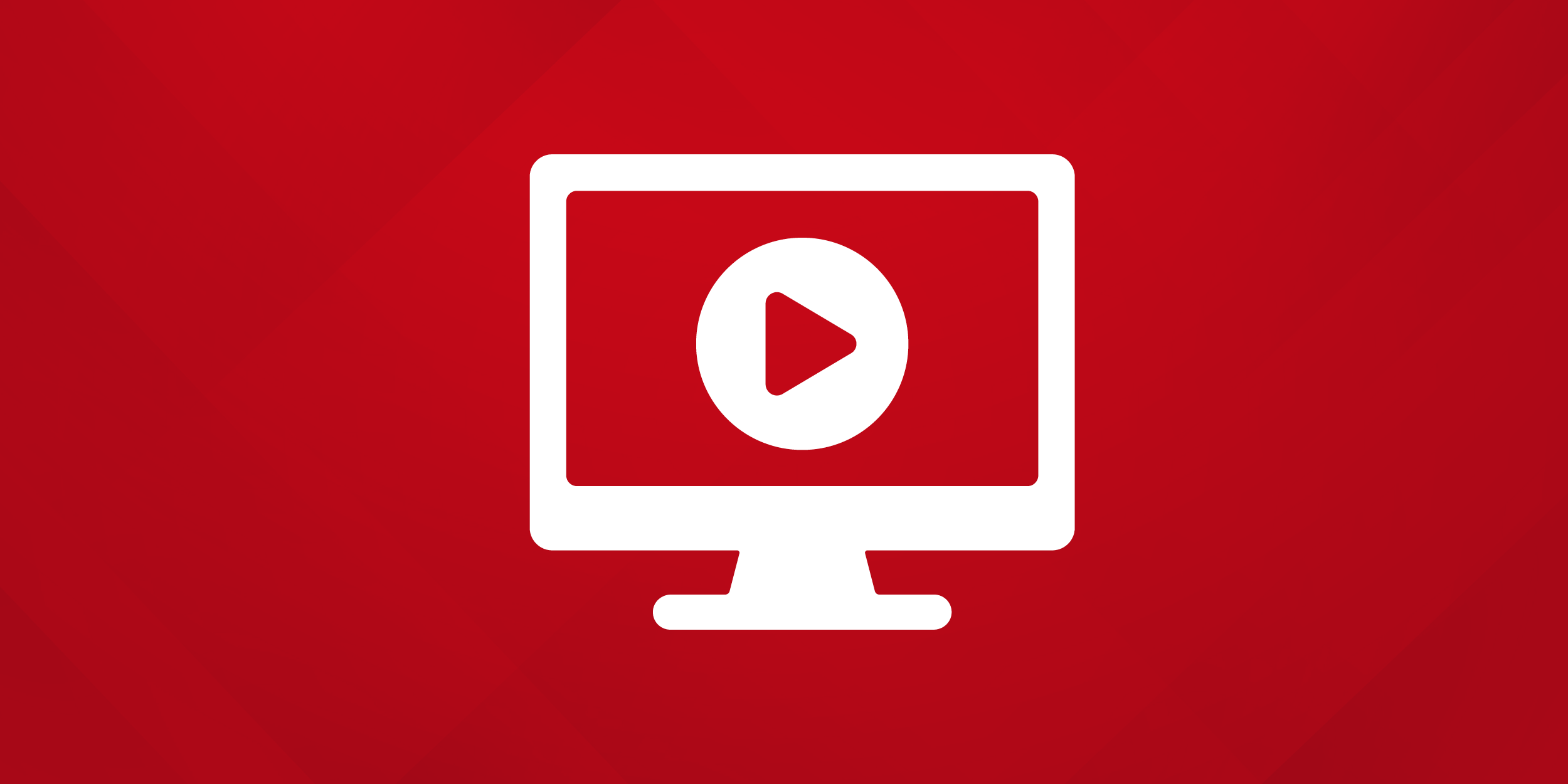 Icon of a white computer monitor displaying a play button on a red background, symbolizing online video streaming or media playback.