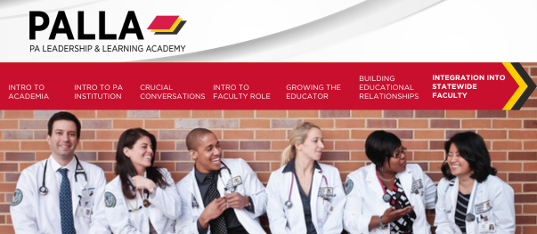 5 students in white coats laughing against brick wall